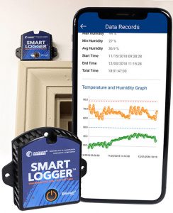 Wagner Smart Logger devices beside a phone showing a temperature and humidity graph